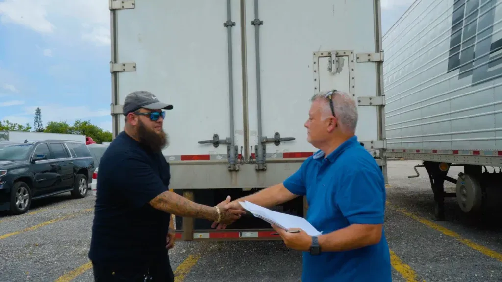 trucker signing paperwork